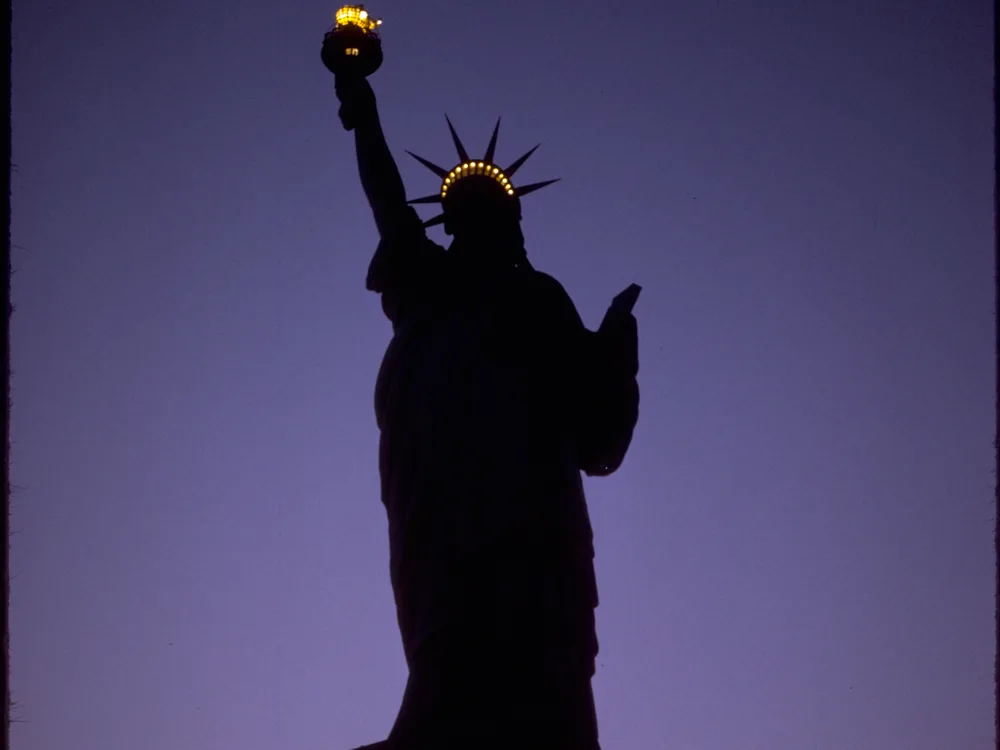 The Statue of Liberty standing against a clear sky